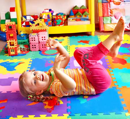 Young girl playing in classroom